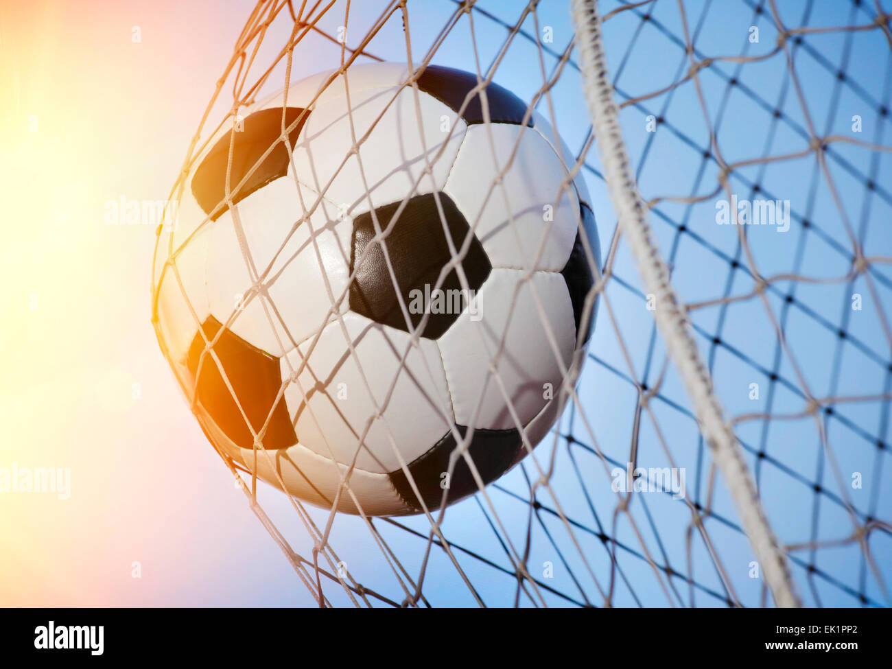 Soccer ball kicked into the back of a goal Stock Photo Alamy