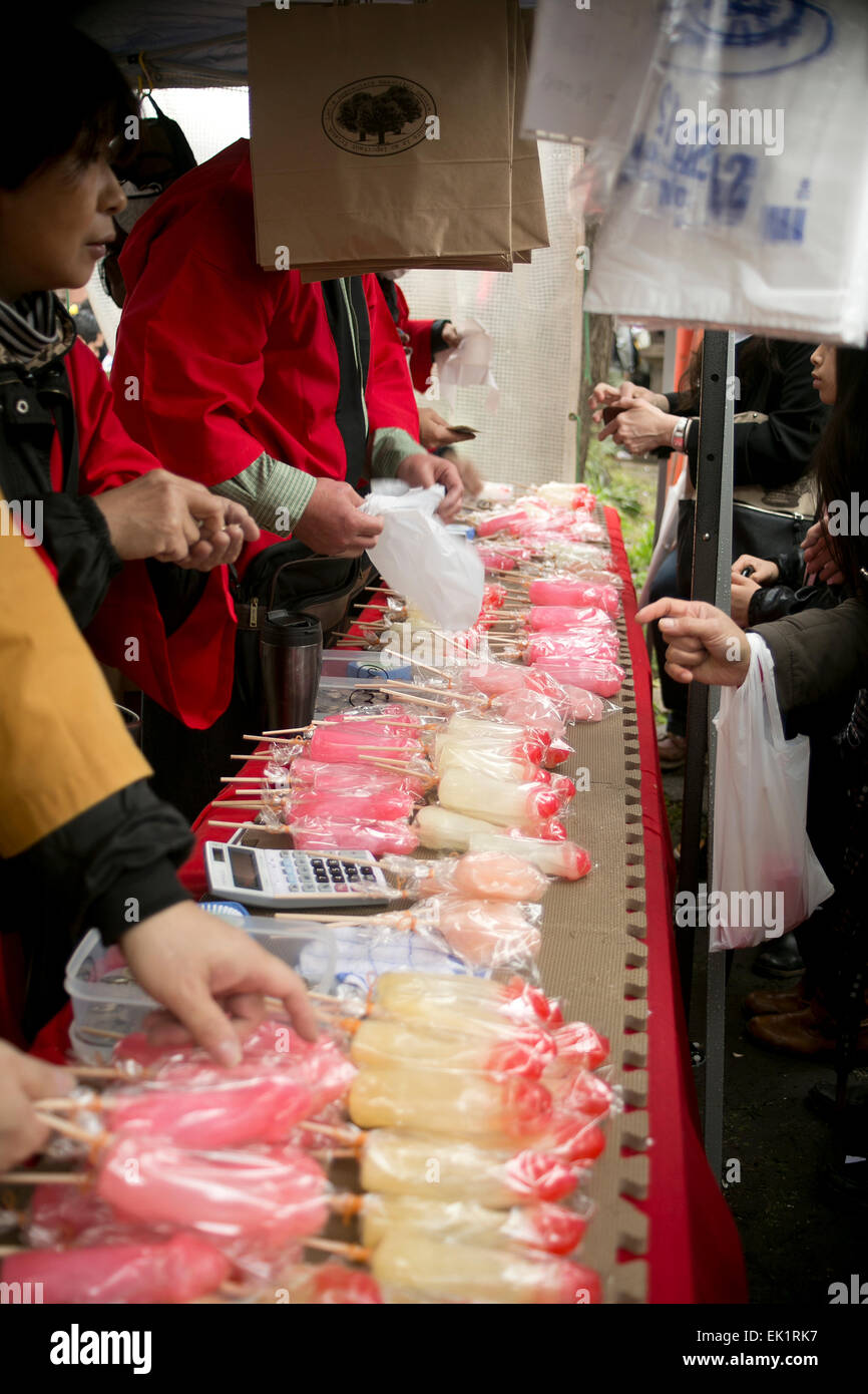 Visitors buy phallus candies during the Kanamara Festival at Kawasaki