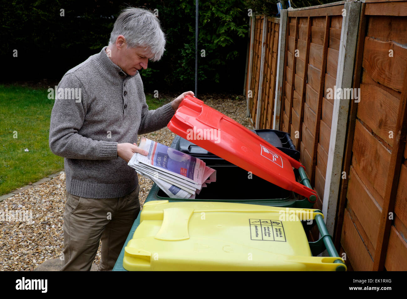 Many councils provide wheelie-bins for the recycling of household waste such as paper, plastic, tin and glass. Stock Photo