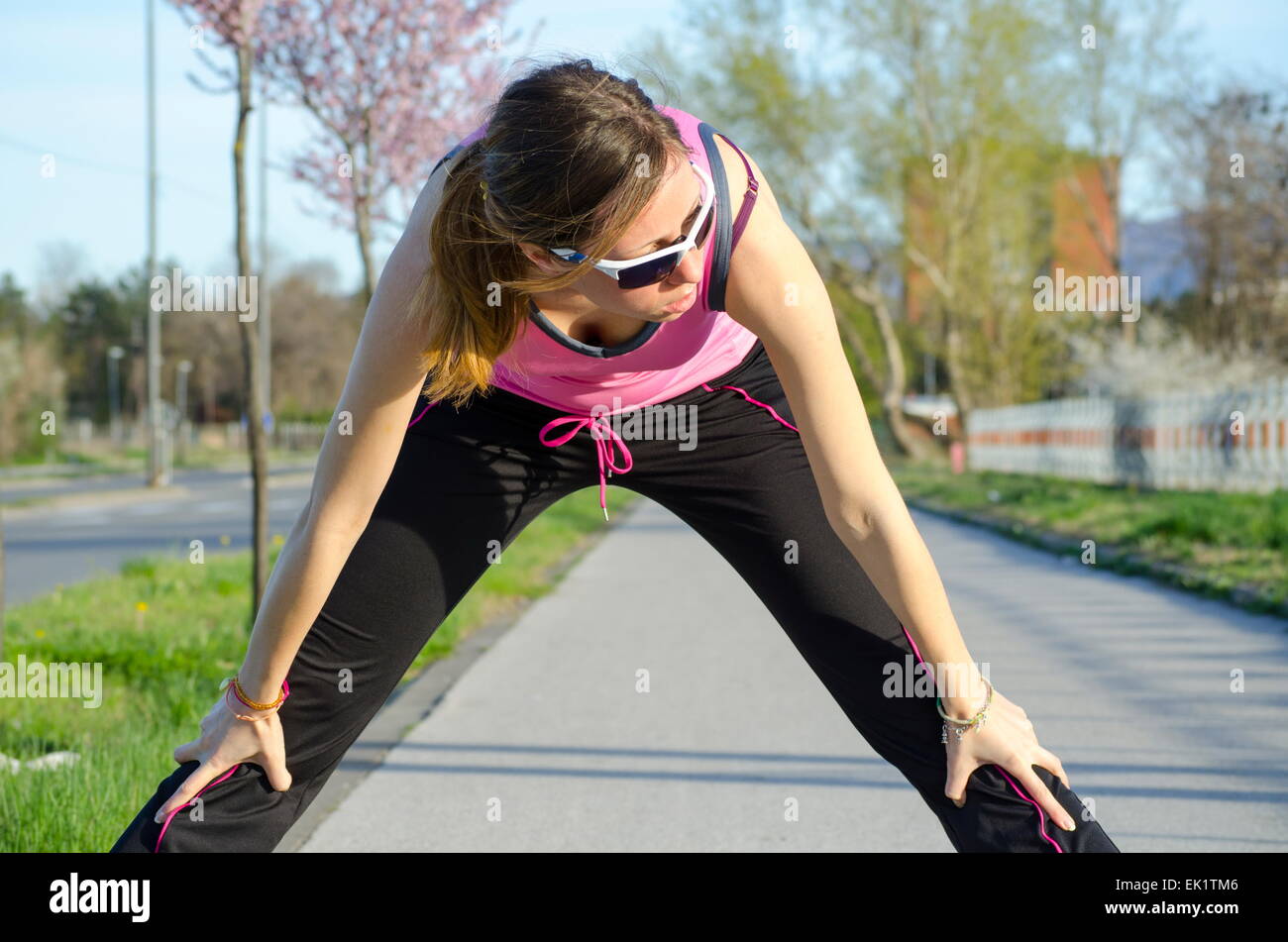 Young girl stretching  outdoors Stock Photo