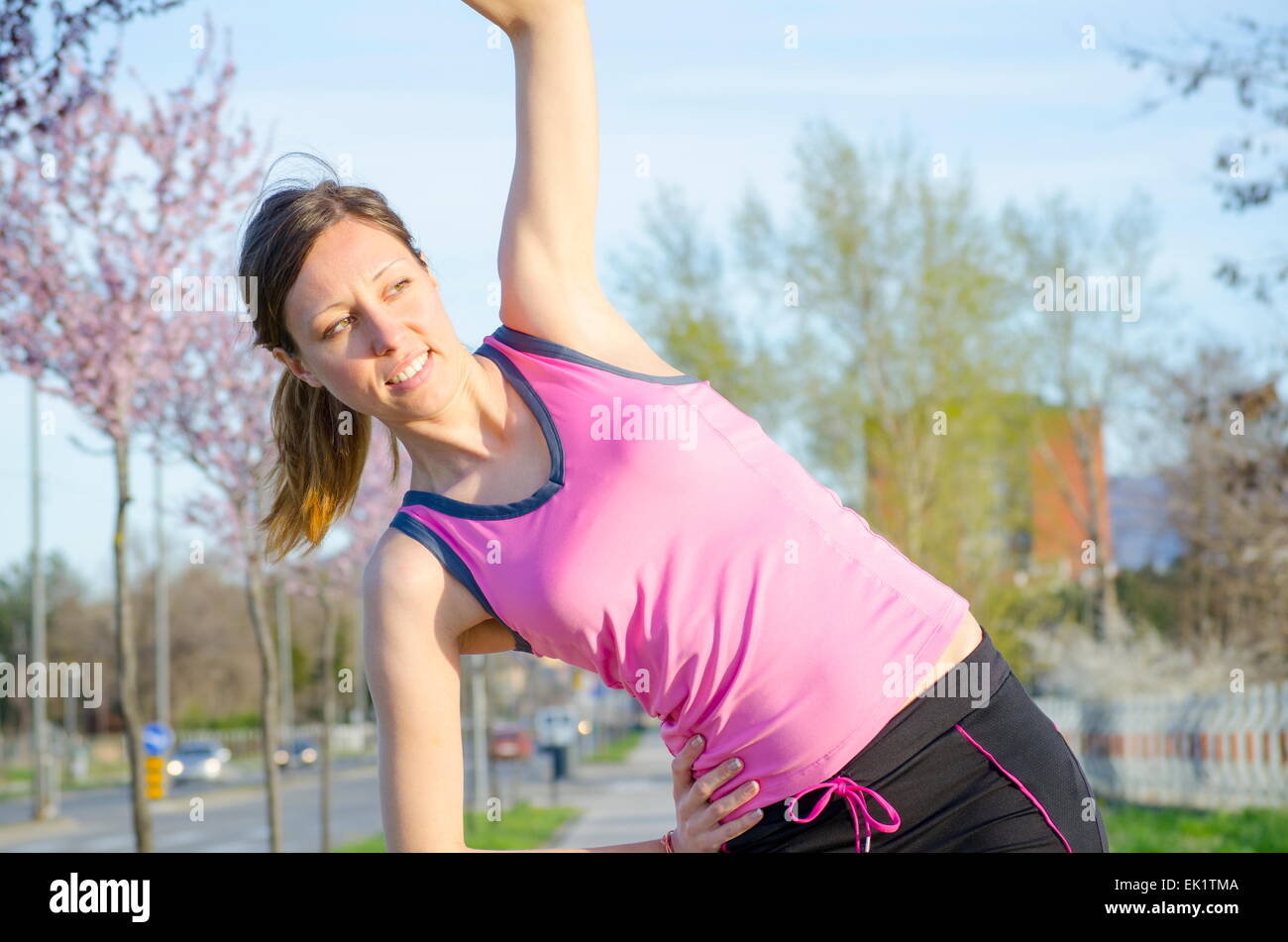 Young girl exercising on a sunny spring day Stock Photo