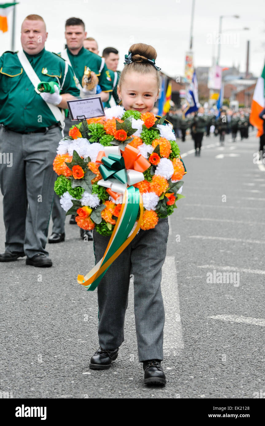 Belfast, Northern Ireland, UK. 5th April, 2015. A young girl carrying a wreath leads the parade as the National Graves Association and Sinn Fein commemorate the 99th anniversary of the Irish Easter Rising, Belfast Credit:  Stephen Barnes/Alamy Live News Stock Photo