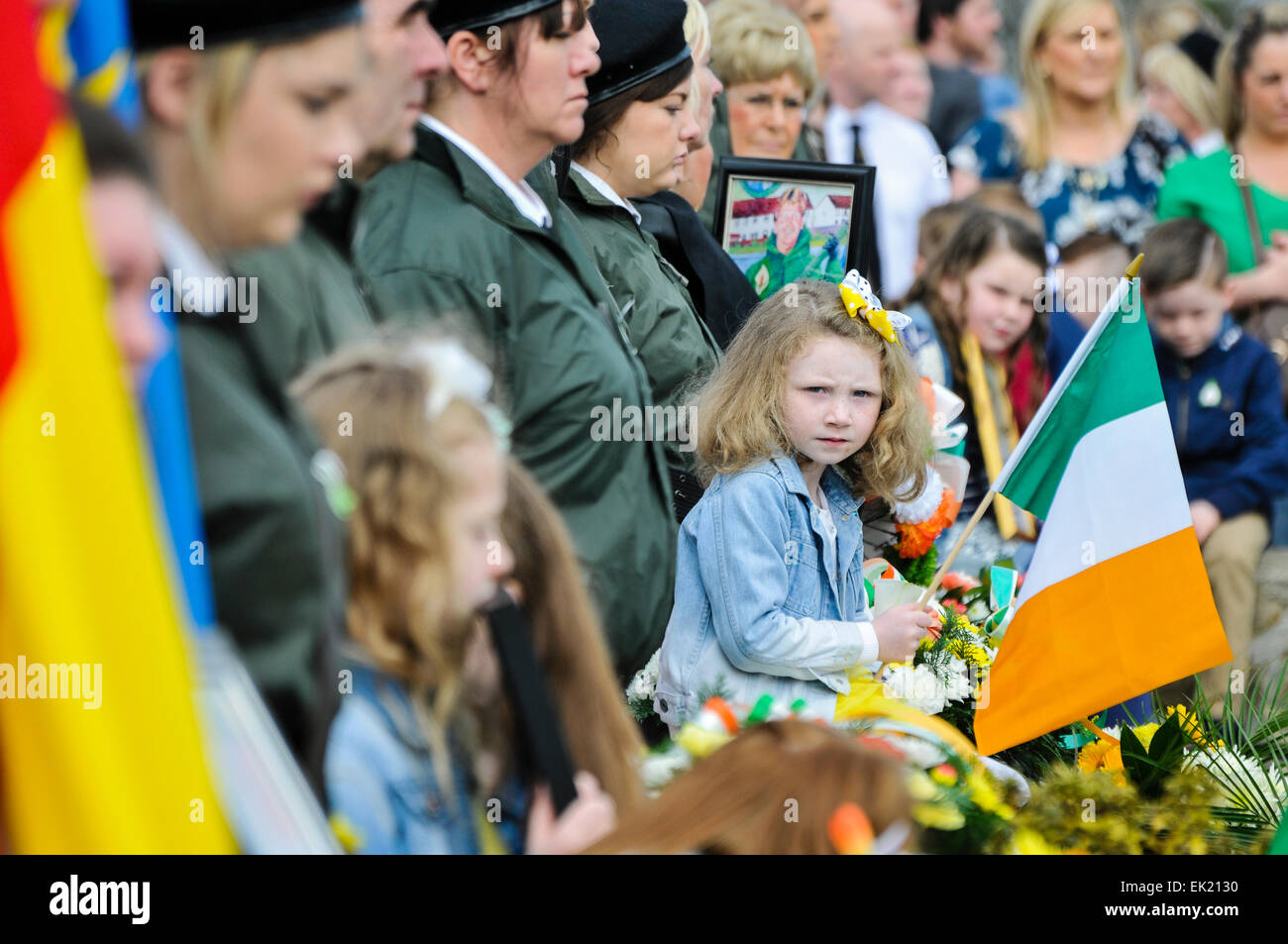 Belfast, Northern Ireland, UK. 5th April, 2015. A young girl holds a tricolour as the National Graves Association and Sinn Fein commemorate the 99th anniversary of the Irish Easter Rising, Belfast Credit:  Stephen Barnes/Alamy Live News Stock Photo