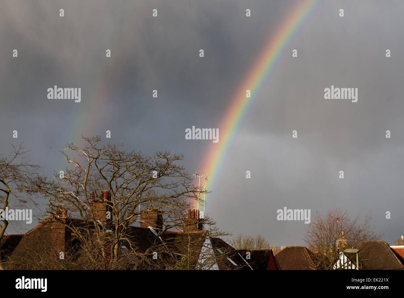 A double rainbow appears over North London rooftops after a rain Stock ...