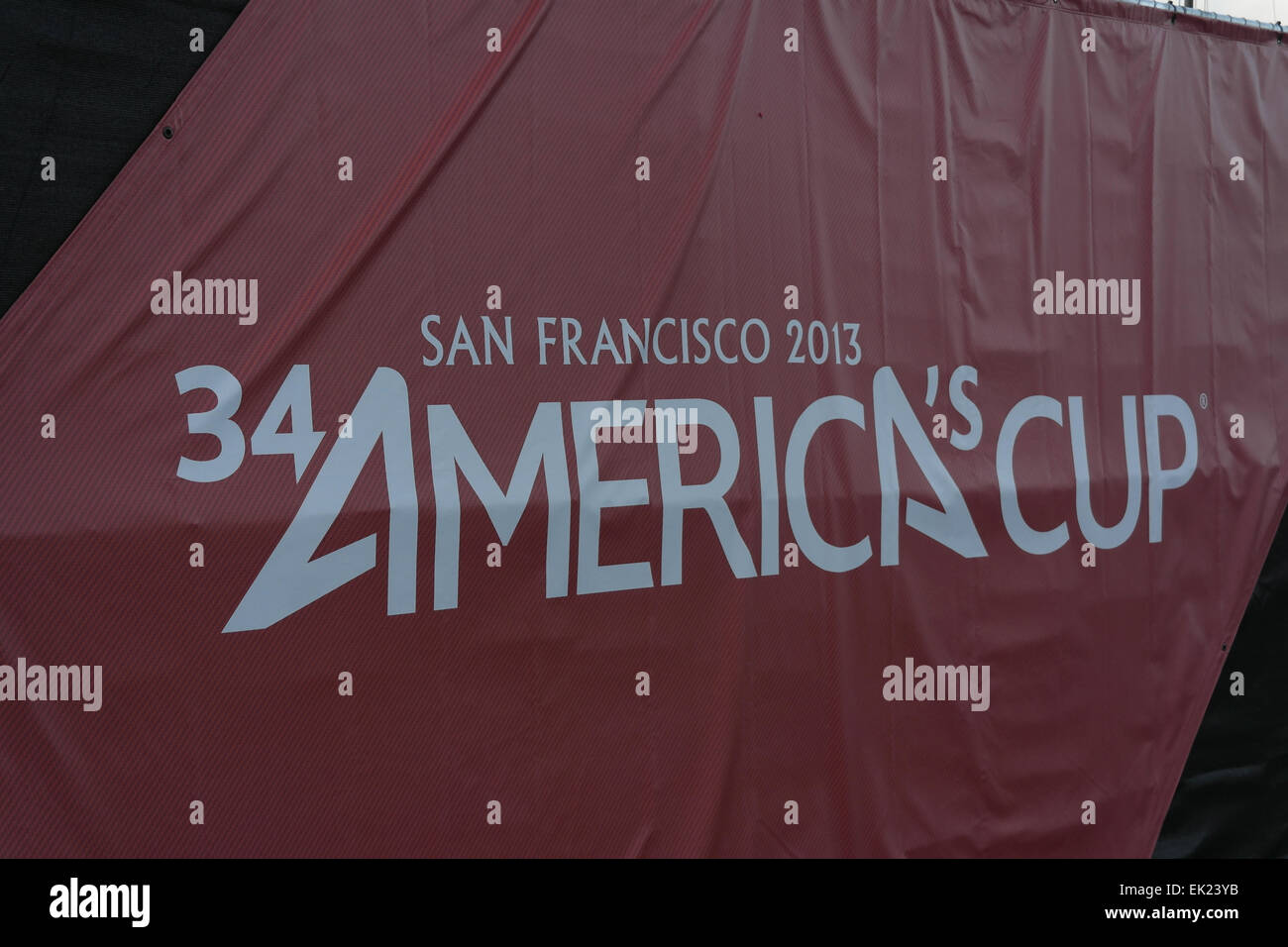 Sign advertising '34th America's Cup San Francisco 2013' on red ten side, Marina Boulevard, San Francisco, California, USA Stock Photo