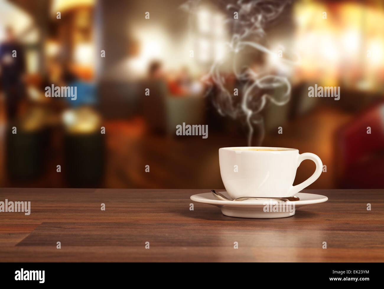 Coffee drink on wooden table with blur cafeteria as background Stock Photo