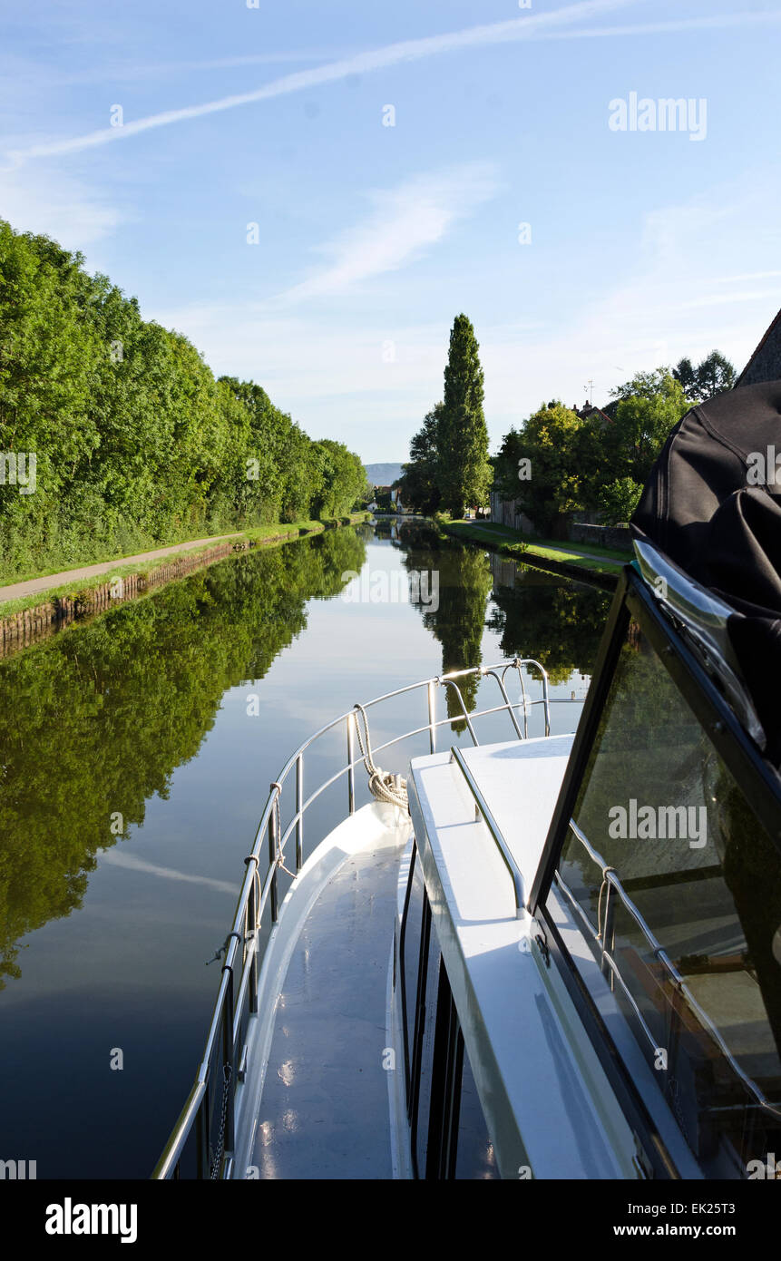 Boating on the Canal du Centre on a placid summer's day, Burgundy, France Stock Photo