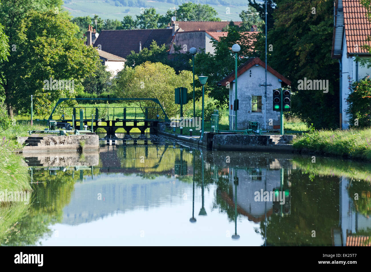 Entering a lock on a peaceful August day, Canal du Centre, Burgundy, France Stock Photo