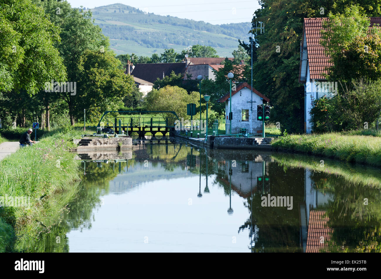 Approaching a lock on a peaceful summer's day, Canal du Centre, Burgundy, France Stock Photo