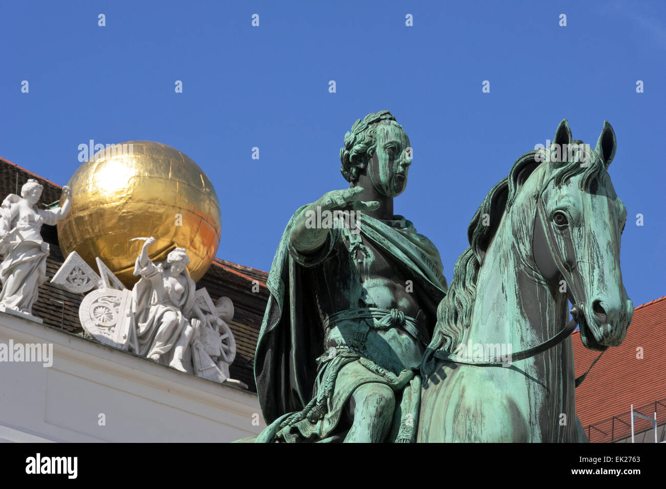 The statue of Emperor Joseph II on horseback with a golden globe on the roof of the Austrian National Library, Vienna, Austria. Stock Photo