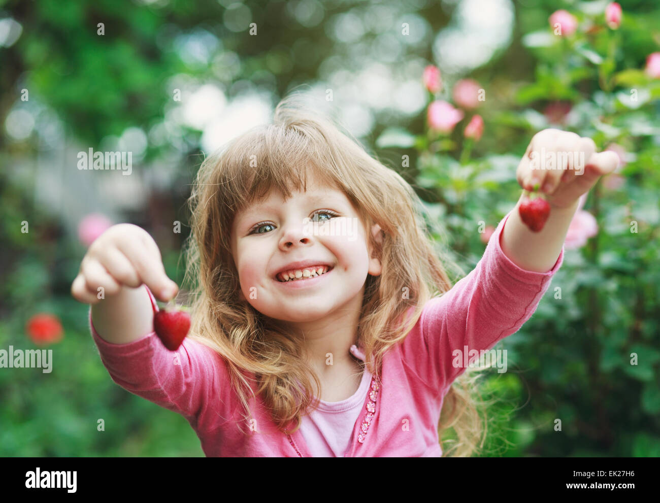 girl play with strawberry Stock Photo - Alamy