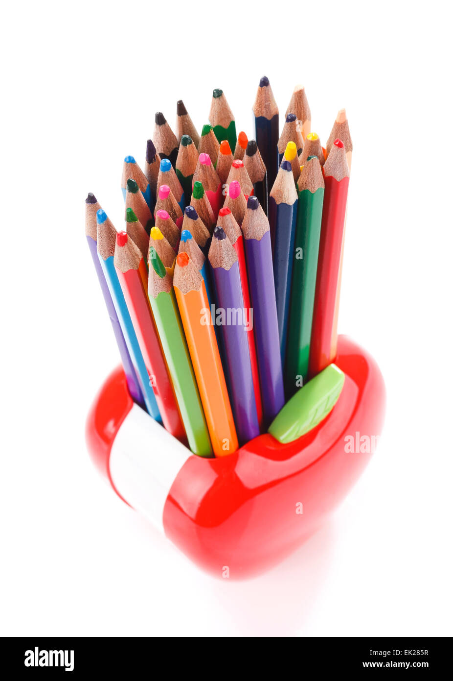 Colorful pencils in apple shaped stand Stock Photo