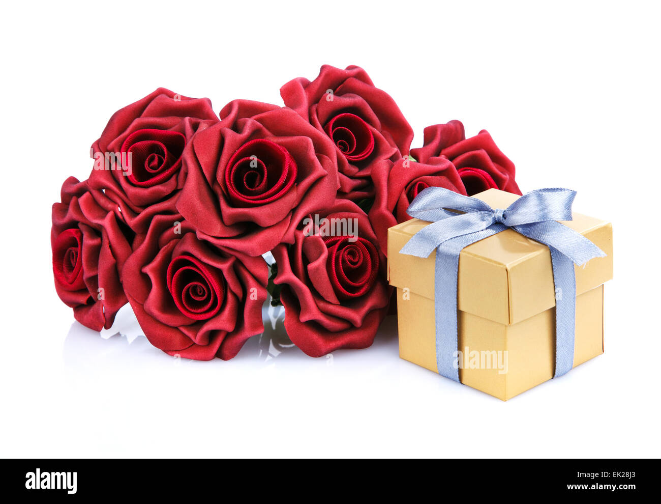 Gift box wrapped in red rose cellophane, decorated with golden