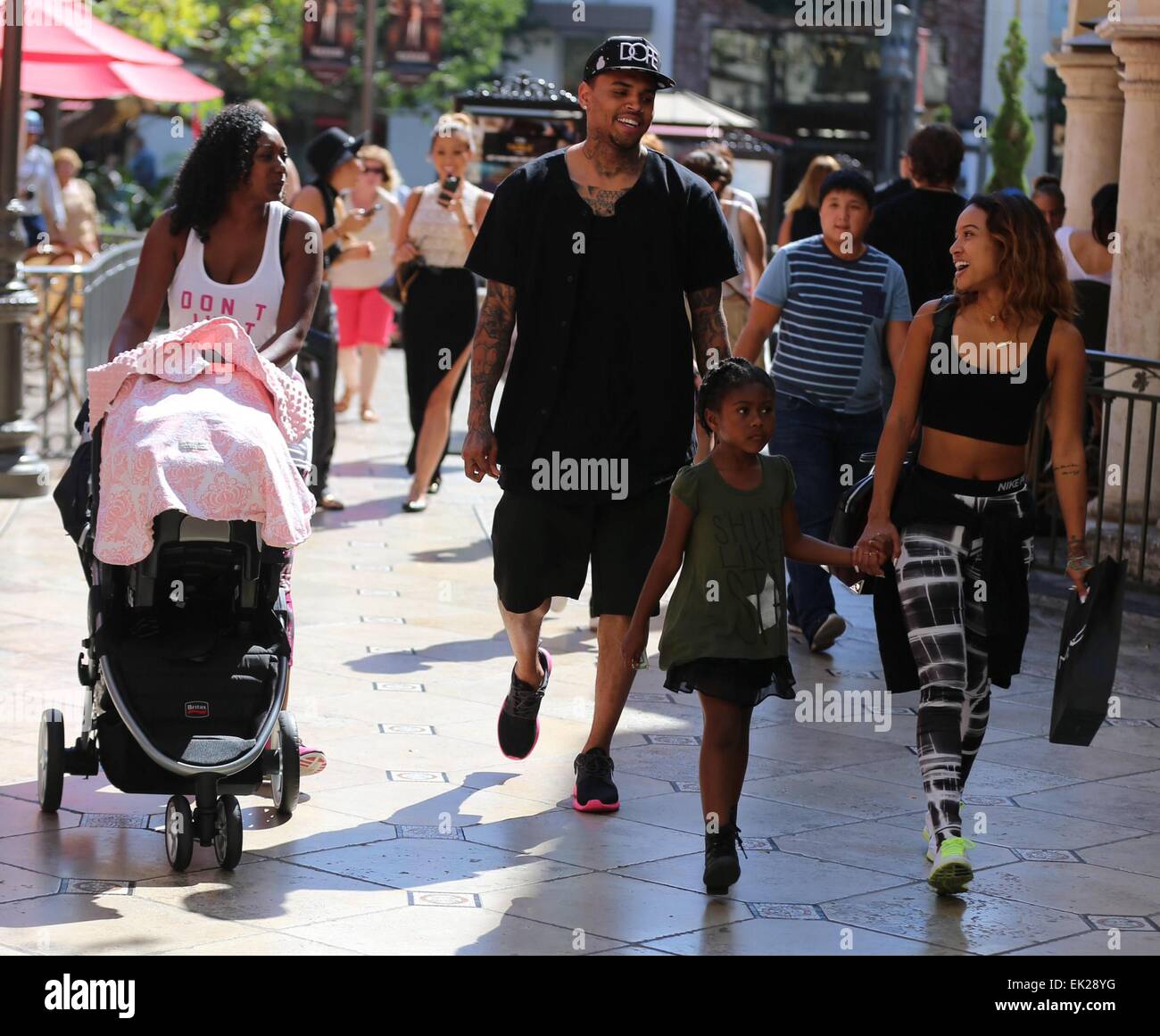 Chris Brown seen with girlfriend Karrueche Tran and friends at The Grove.  They lunched at La Piazza Ristorante then headed for Nordstrom's to shop  before returning to Valet before leaving. Featuring: Chris, image size:1300x1161