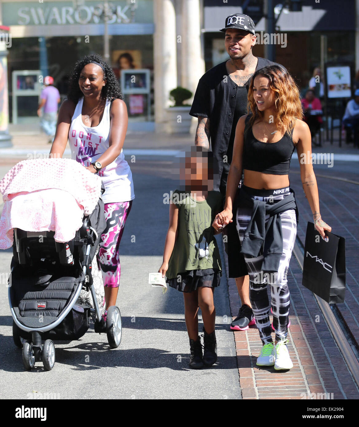 Chris Brown seen with girlfriend Karrueche Tran and friends at The Grove.  They lunched at La Piazza Ristorante then headed for Nordstrom's to shop  before returning to Valet before leaving. Featuring: Chris