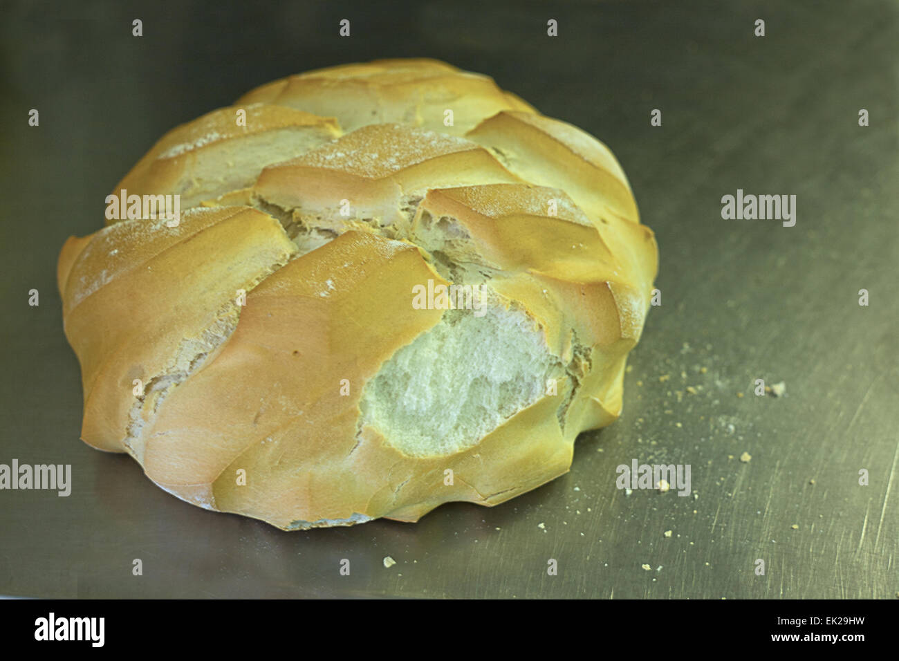 Spanish large loaf bread over aluminium tray freshly baked Stock Photo