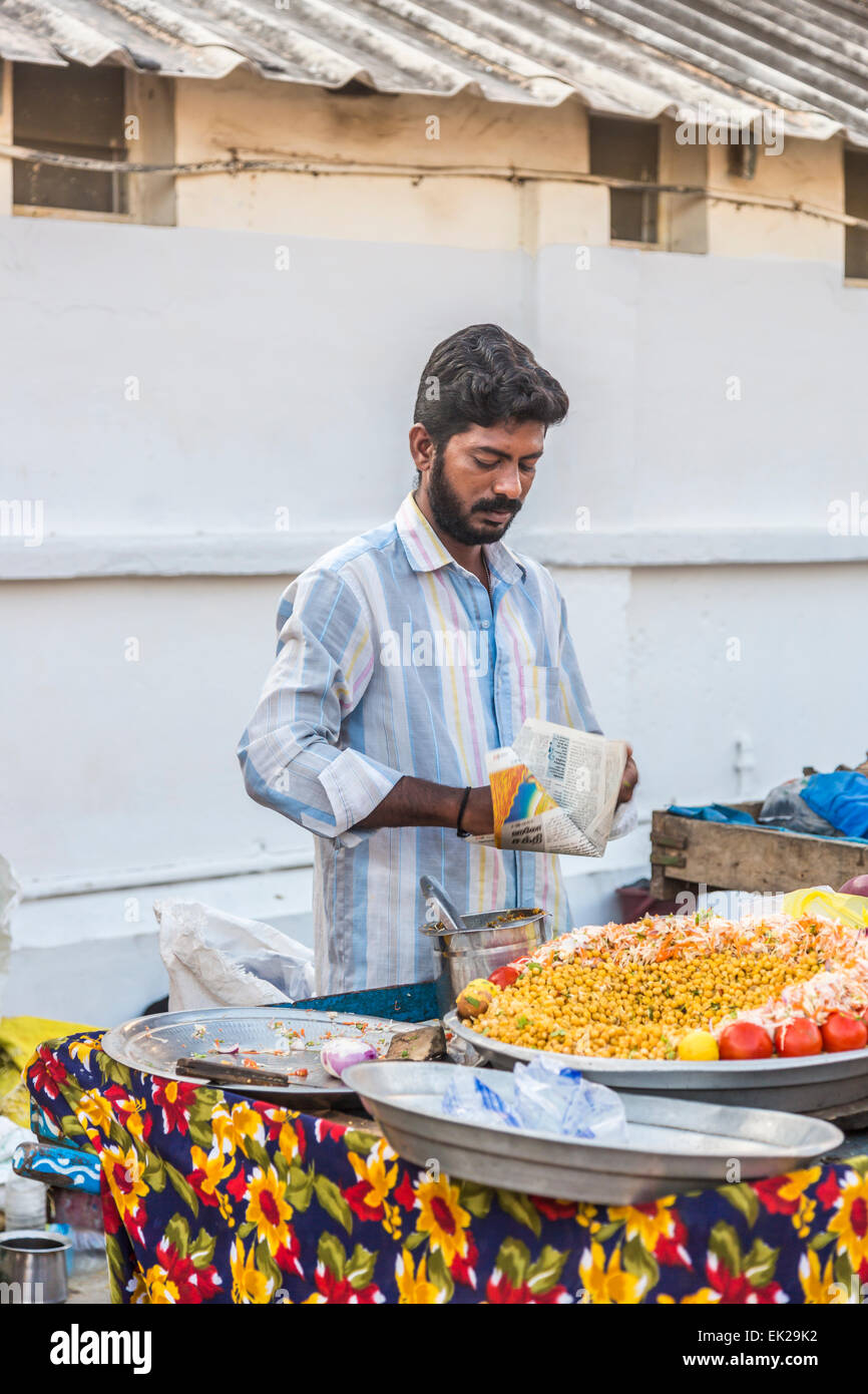 Local Indian man selling vegetarian street food on a roadside market stall Pondicherry, (Puducherry) Tamil Nadu, southern India Stock Photo