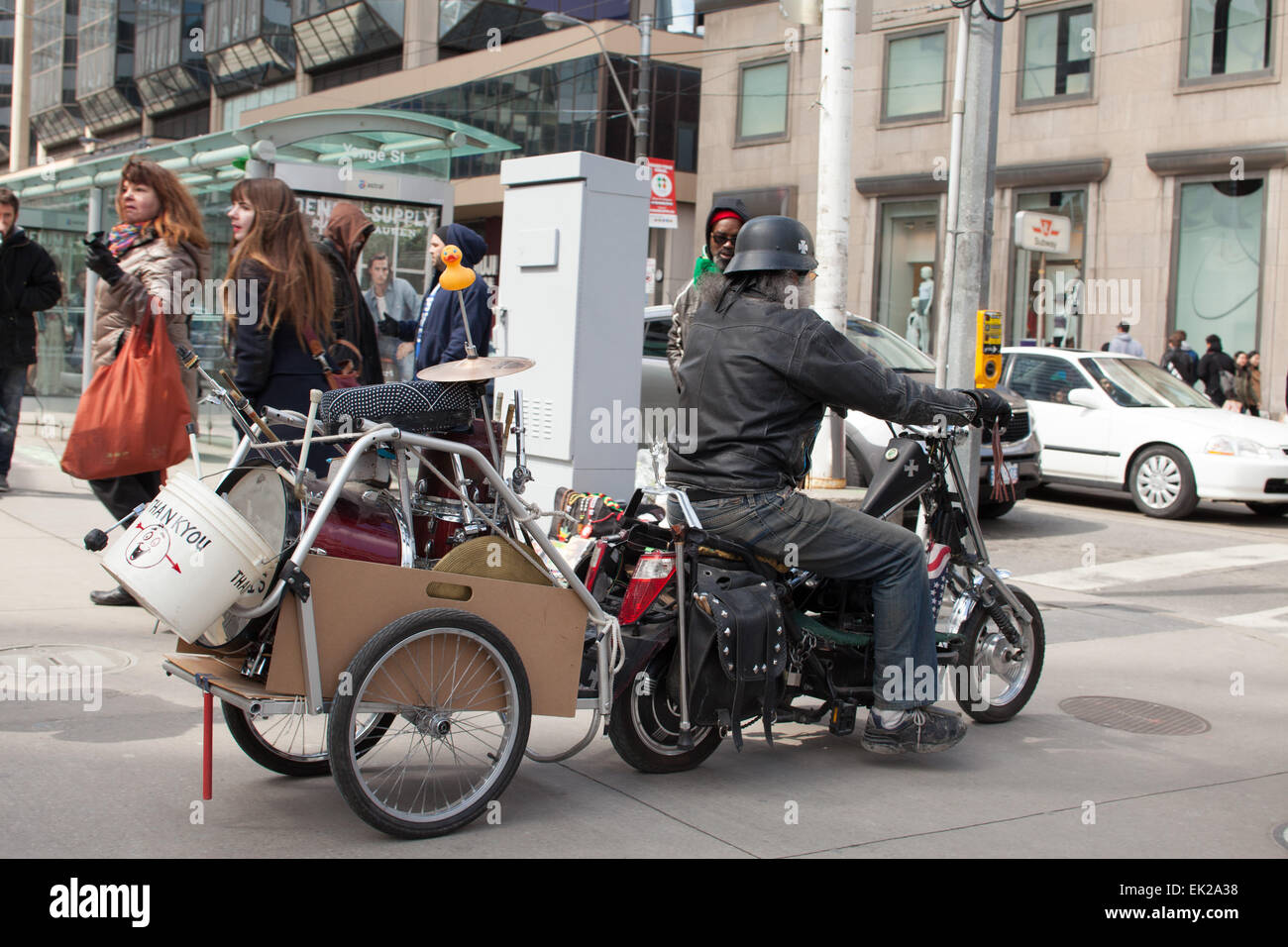 biker on mini bike Toronto,Canada,Yonge and Dundas corner Stock Photo