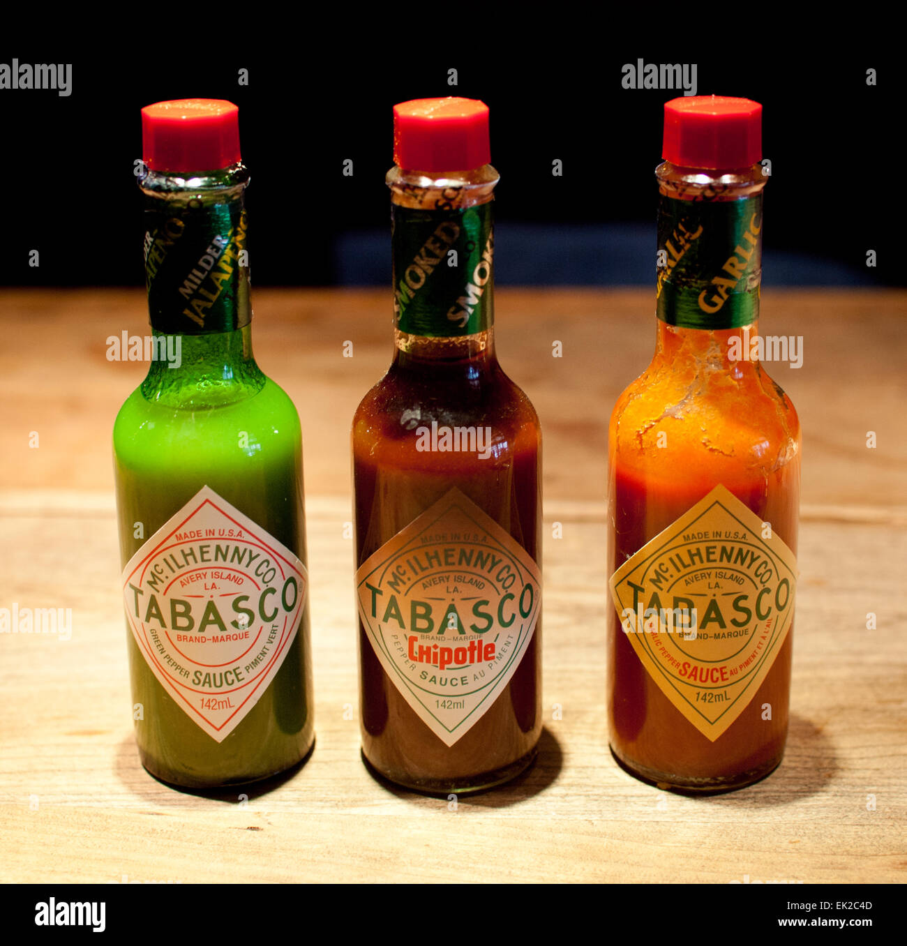Bottles of Tabasco sauce. Jalapeño-based green, chipotle-based smoked and  garlic varieties shown Stock Photo - Alamy