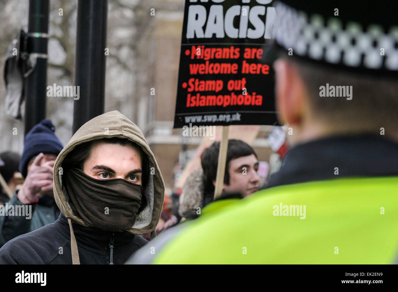 Anti-fascists confronting police at a demonstration against Pergida in Whitehall, London. Stock Photo