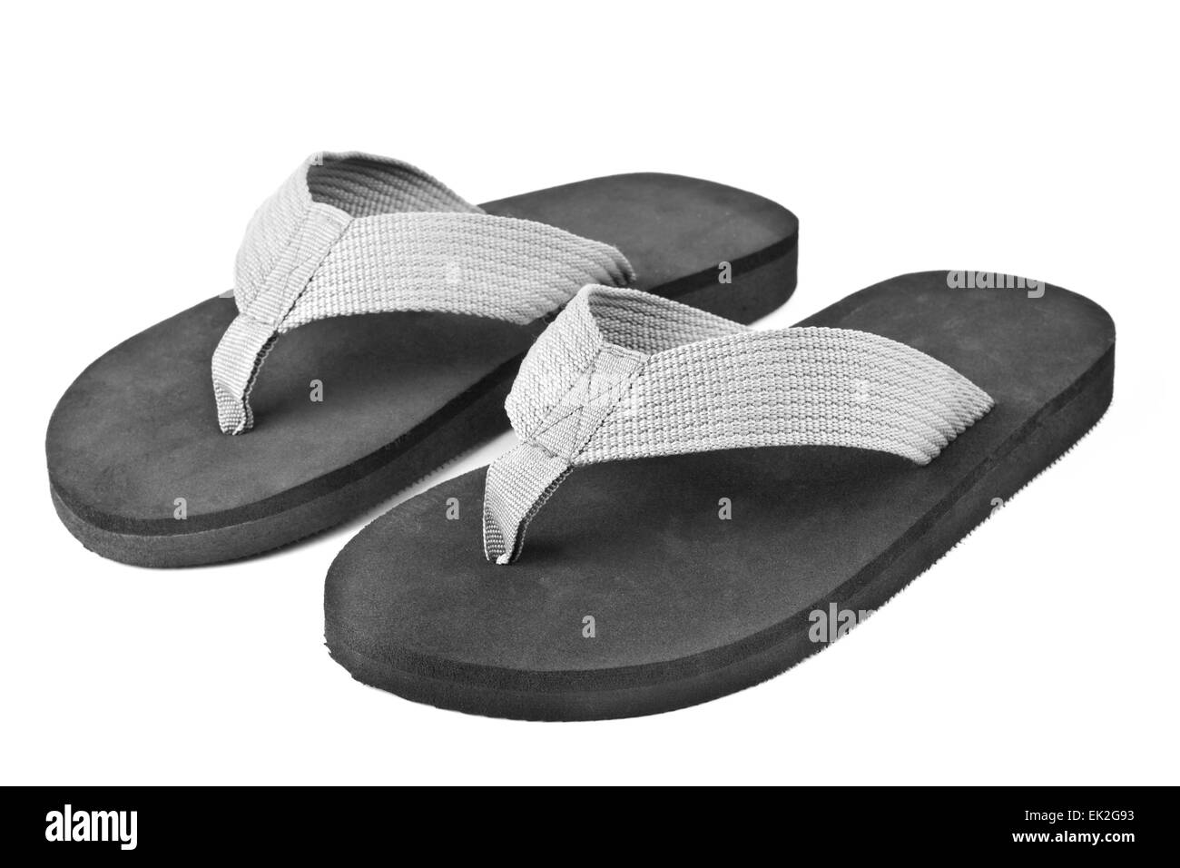 pair of black flip flops isolated on white background Stock Photo - Alamy