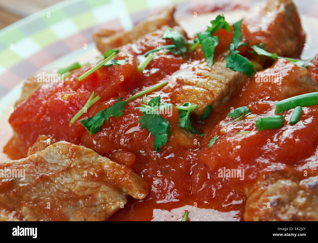 Mexican Grillades and Grits.close up.medallions of various meats Stock Photo