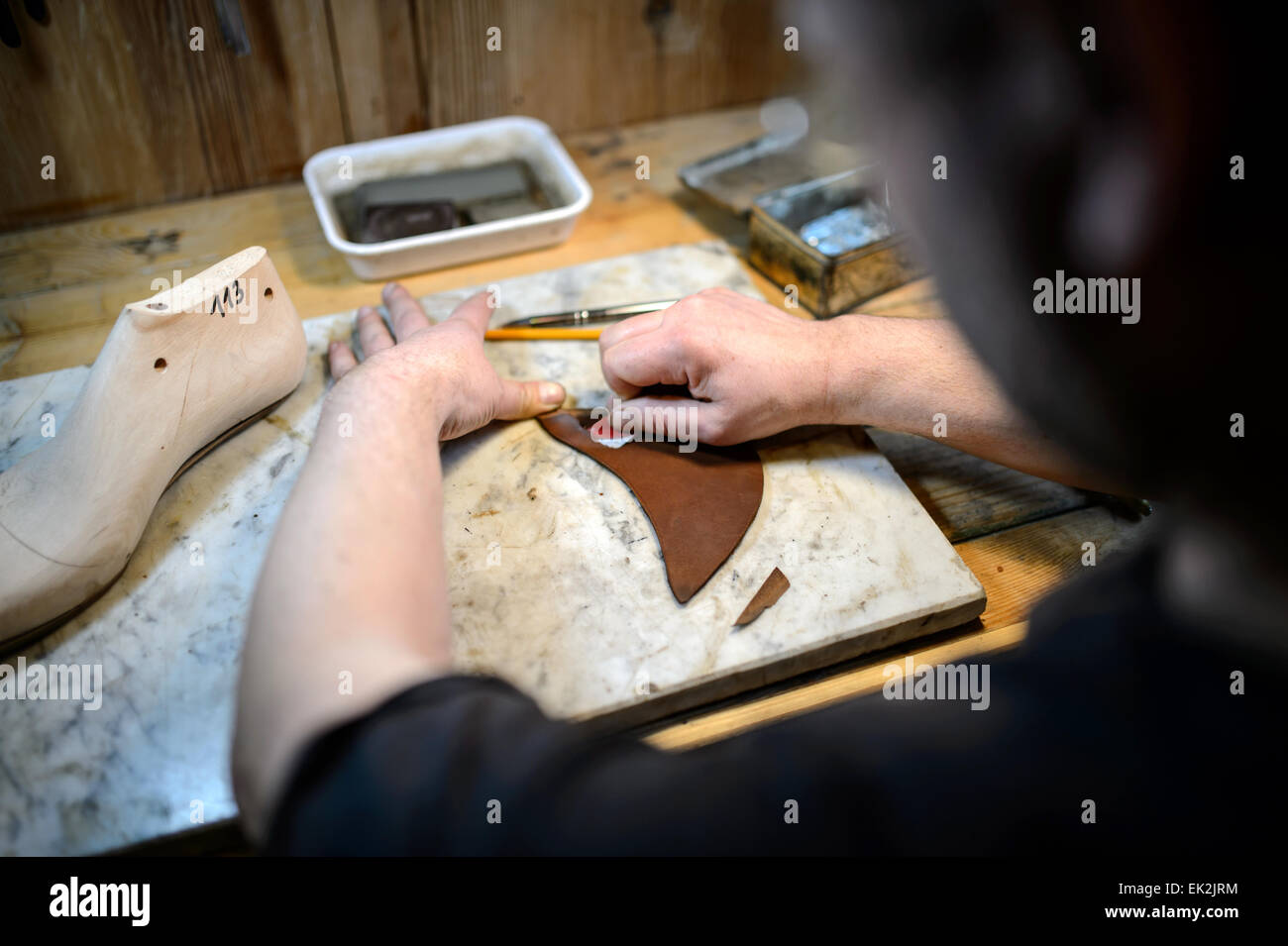 Dresden, Germany. 12th Mar, 2015. Shoemaker Alexander Preiss works on a ...