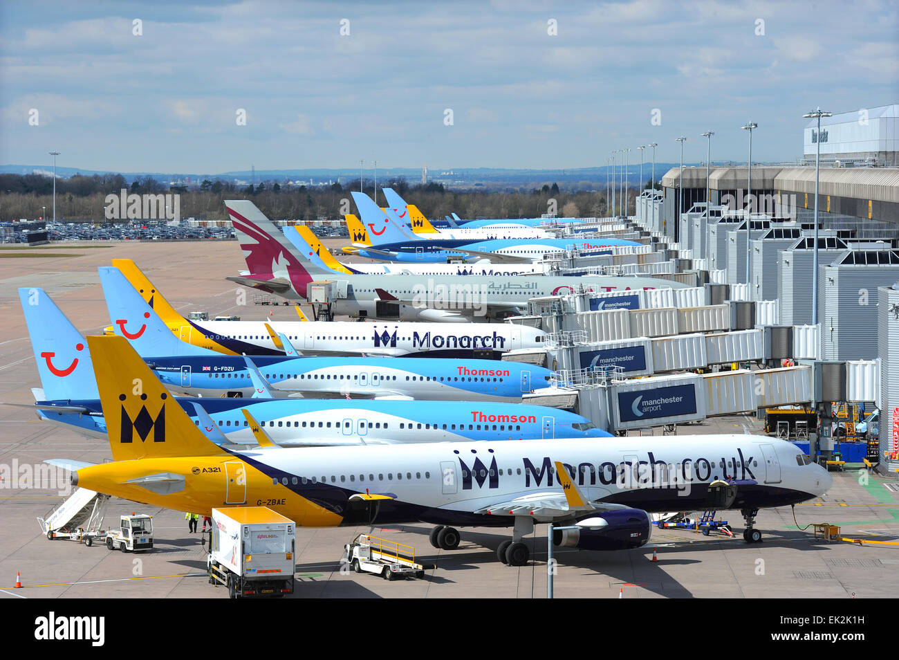 Planes lined up by the terminal at Manchester International Airport