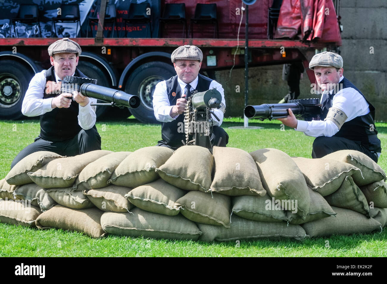 Larne, Northern Ireland. 26 Apr 2014 - Three men wearing period costumes hold a Vickers Light machine gun and two Lewis Automatic  machine guns as part of the commemoration of the 1912 UVF gun-running Stock Photo