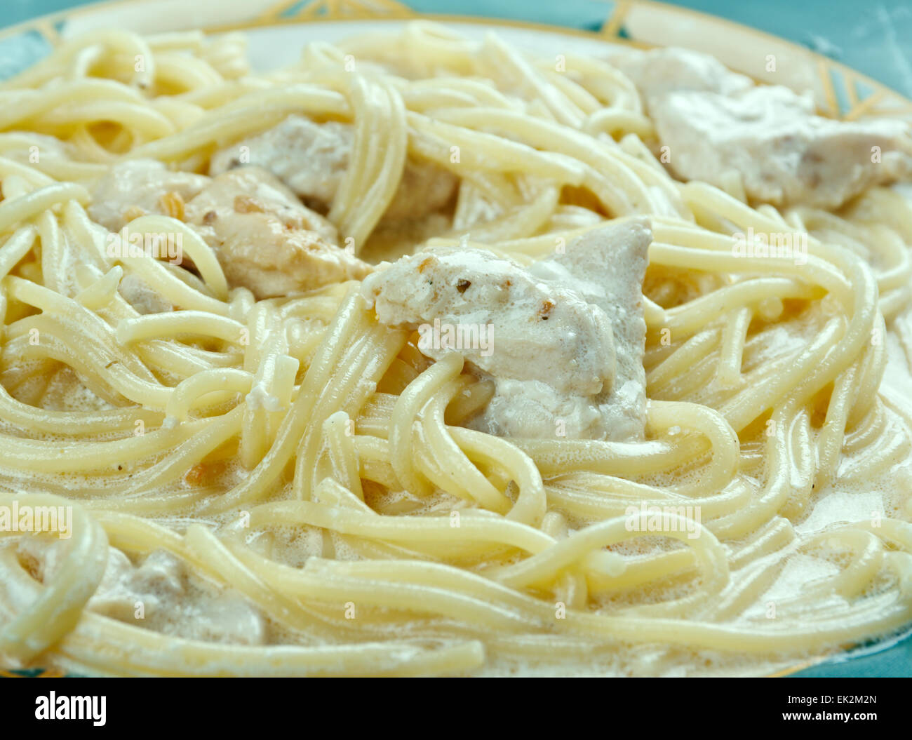 Spaghetti with chicken in a creamy sauce Stock Photo