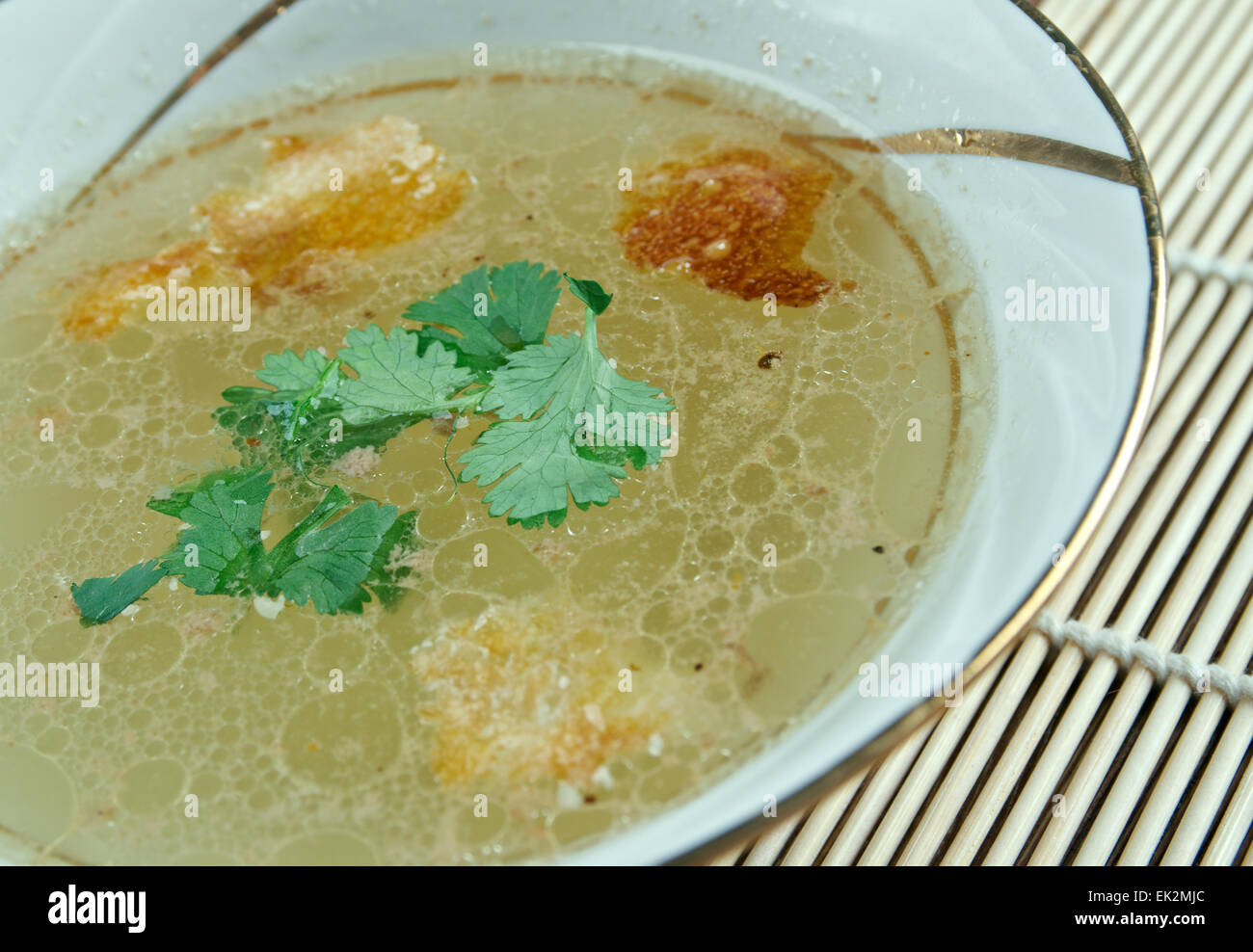 Beef Consomme - clear soup made from richly flavored stock or bouillon. Stock Photo