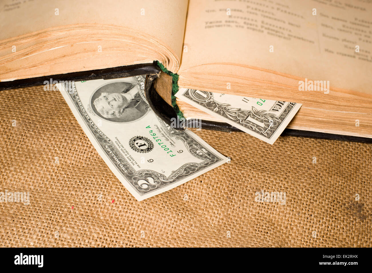 Open book with a bookmark from $ 1 on sacking Stock Photo