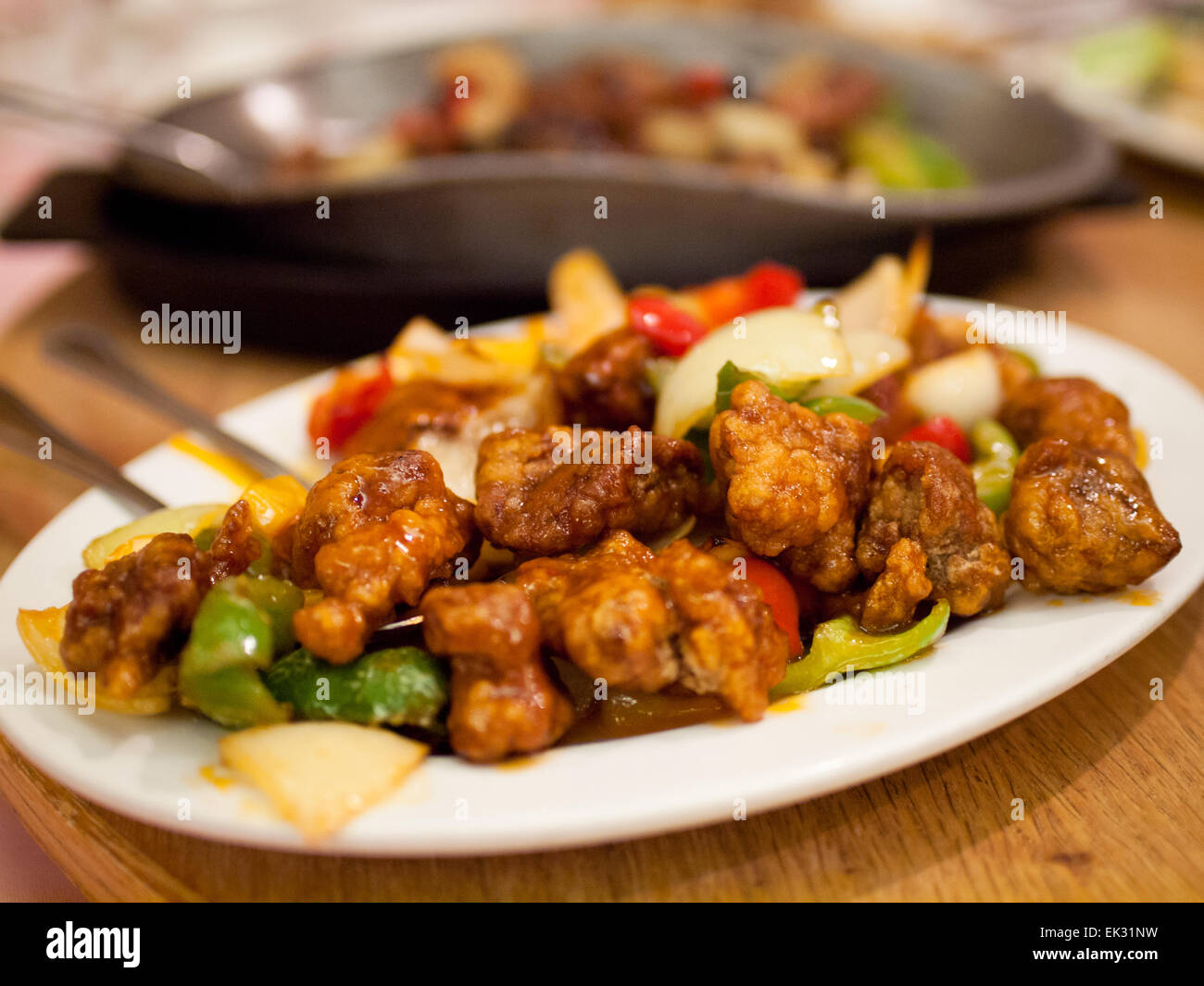 Sweet and sour pork at a Chinese restaurant. Stock Photo