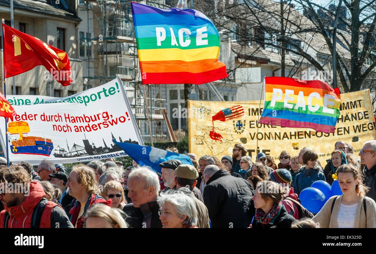 Hamburg, Germany. 6th Apr, 2015. Around 800 peace movement supporters move through downtown Hamburg during the traditional Easter march in Hamburg, Germany, 6 April 2015. Some of the protesters are holding up a flag that reads 'PACE'. One of the banners reads 'Keine Atom-Transporte! Weder durch Hamburg noch anderswo!' (No nuclear waste transports! Neither in Hamburg nor anywhere else!). Credit:  dpa picture alliance/Alamy Live News Stock Photo