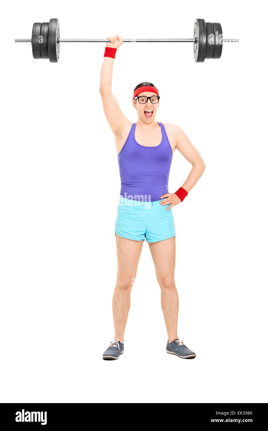 Full length portrait of a strong nerdy athlete holding a heavy weight in one hand isolated on white background Stock Photo