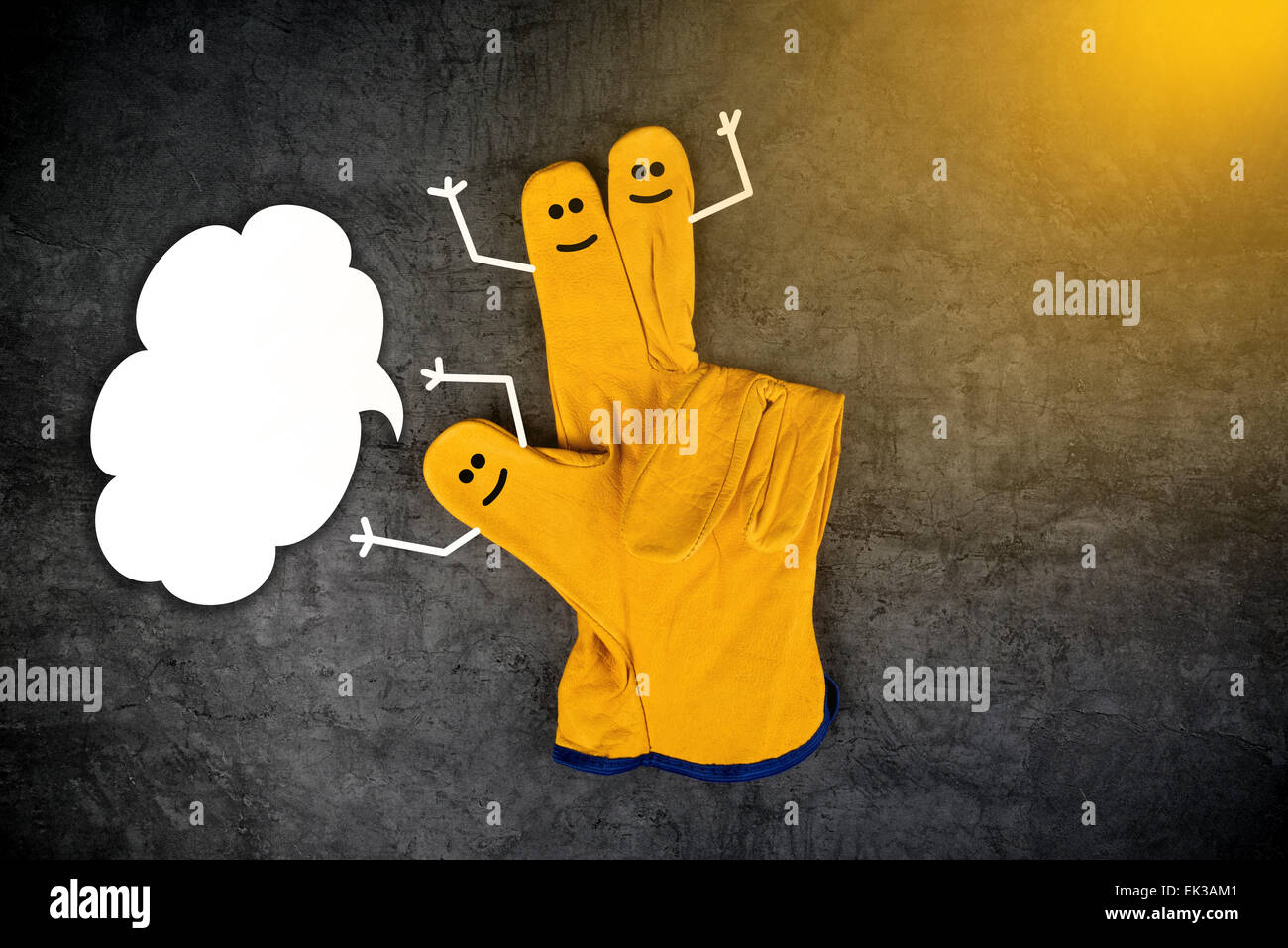 Three Happy Laughing Smileys on Fingers of Yellow Leather Protective Construction Industry Working Gloves with Speech Balloon as Stock Photo