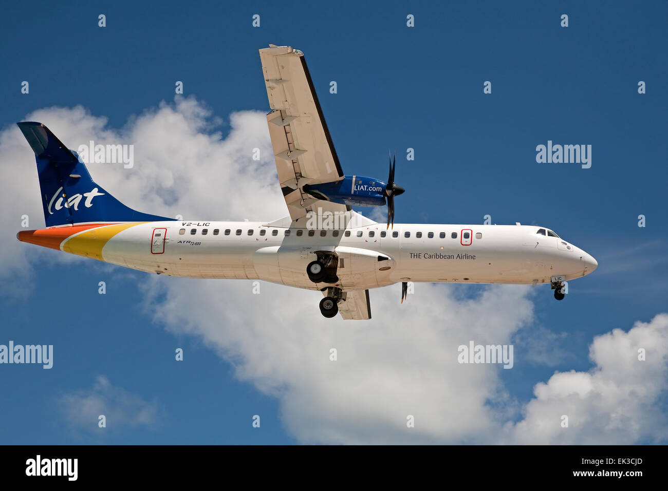 The Caribbean Airline Plane Flies Low Over Maho Beach In St Maarten In 