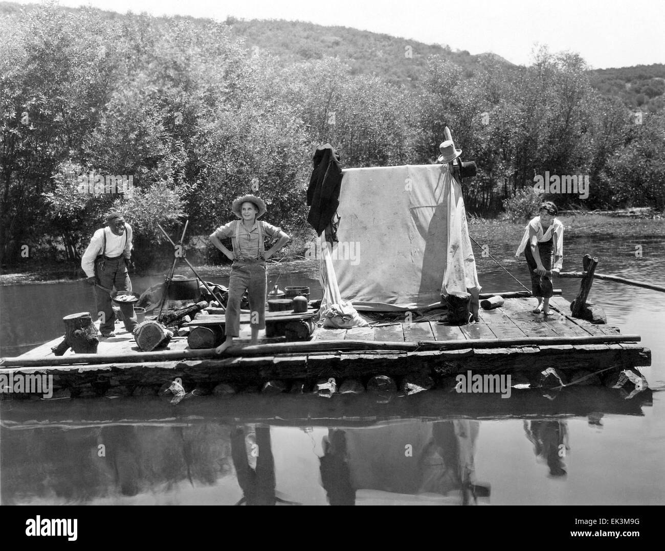 Clarence Muse, Jackie Coogan, Junior Durkin, on-set of the Film 'Huckleberry Finn', 1931 Stock Photo