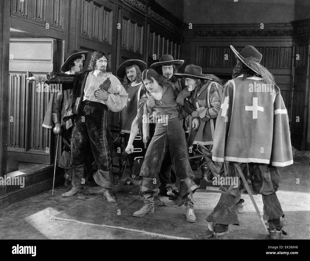 Douglas Fairbanks, (center), on-set of the Silent Film 'The Three Musketeers', 1921 Stock Photo