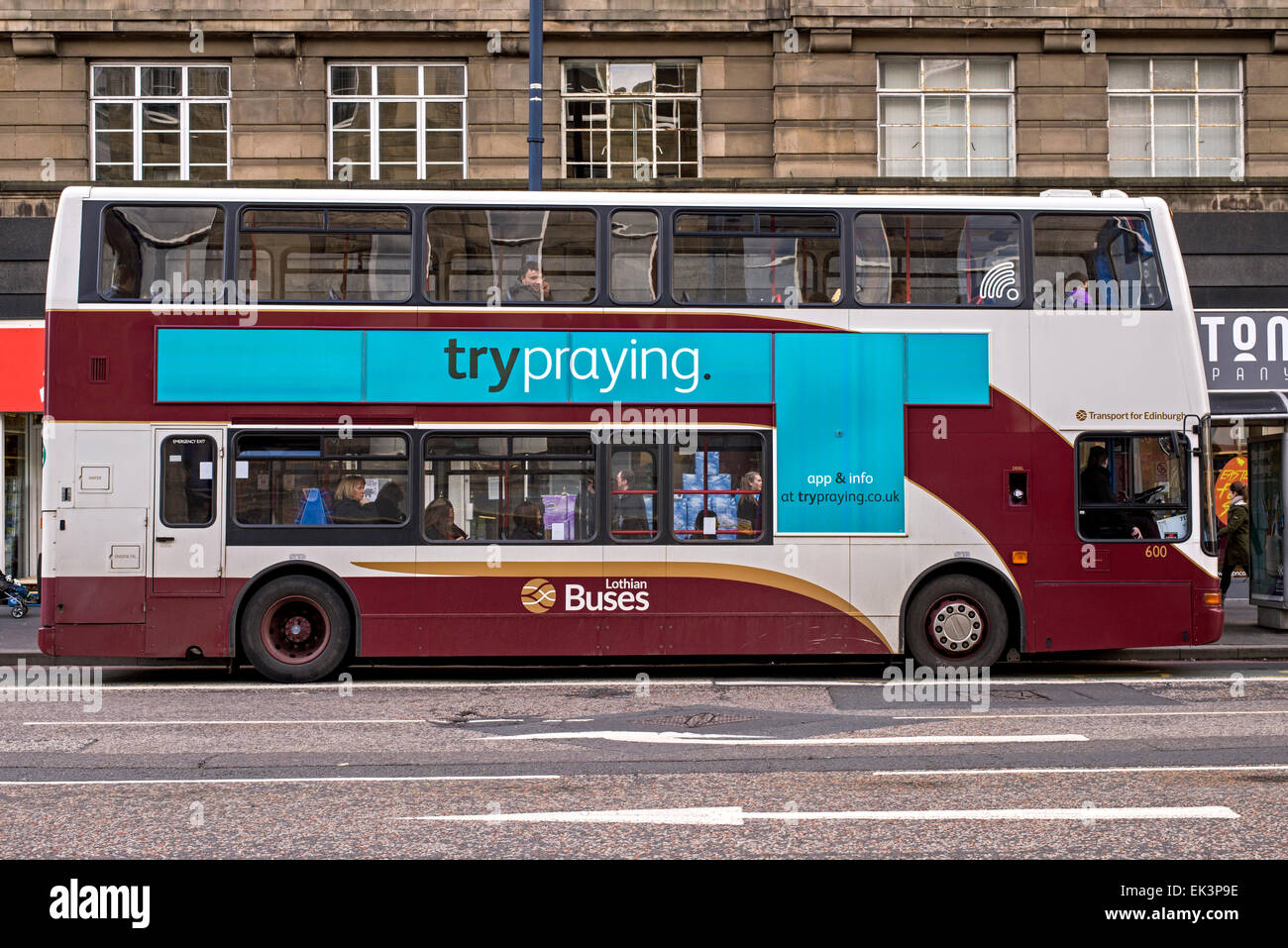 A Lothian Busses bus with the message 'try praying' on the side. Stock Photo