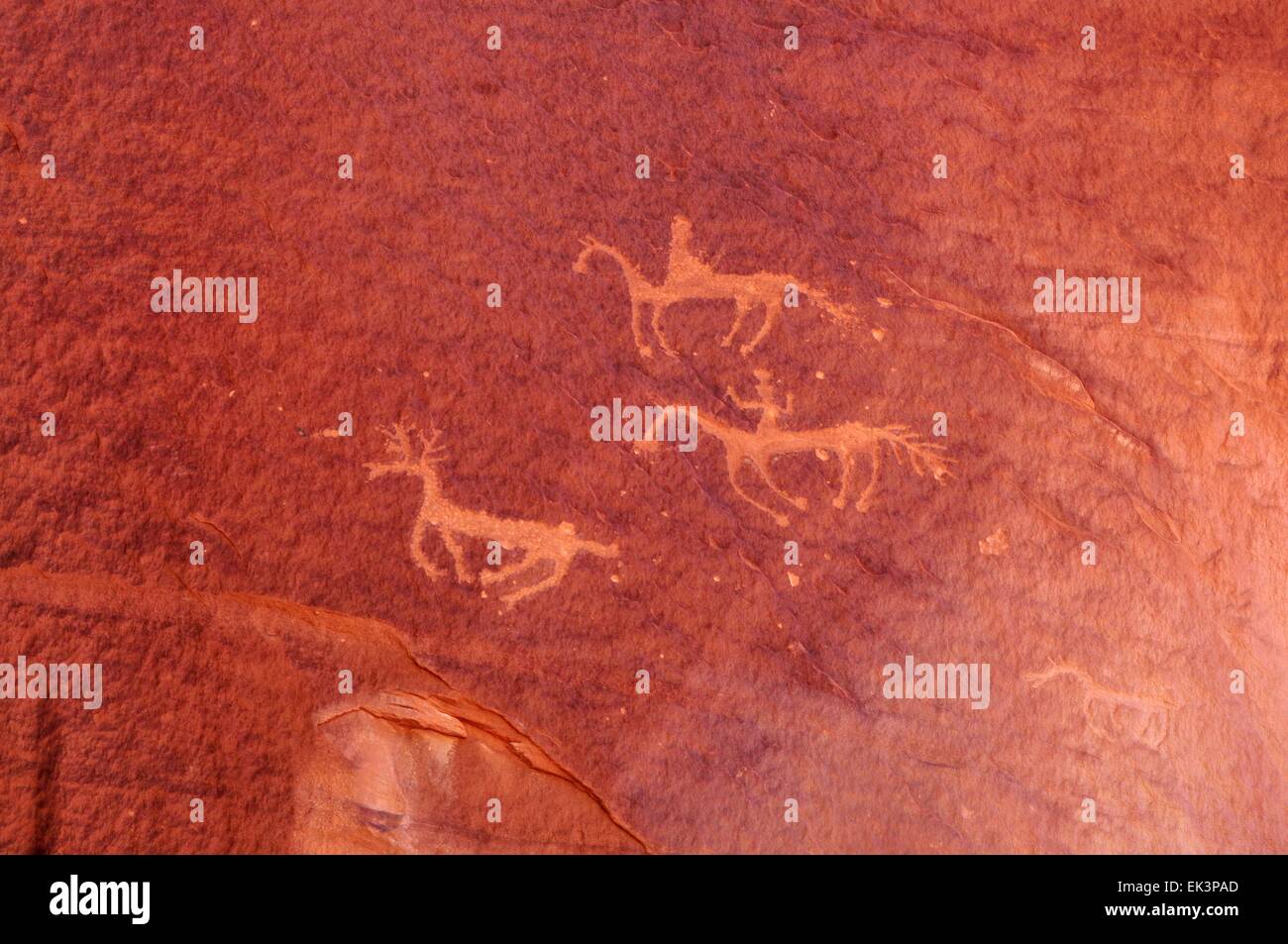 The hunt -  petroglyph on wall in Canyon De Chelly Chinle, Arizona  - USA Stock Photo