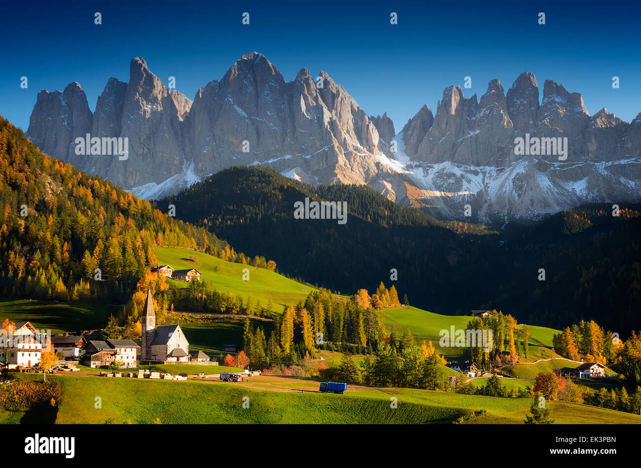 St. Magdalena or Santa Maddalena village  in front of the Geisler Dolomites mountain peaks in the Val di Funes in Italy. Stock Photo