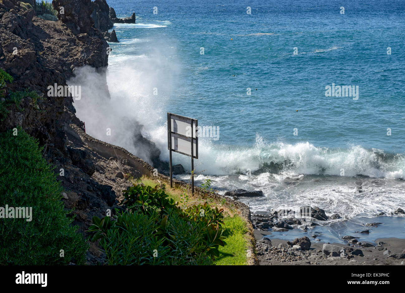 Very high stormy splash of ocean wave on rock of Arena beach with lot of foam and cloud of water dust, Tenerife, Canary Islands, Stock Photo