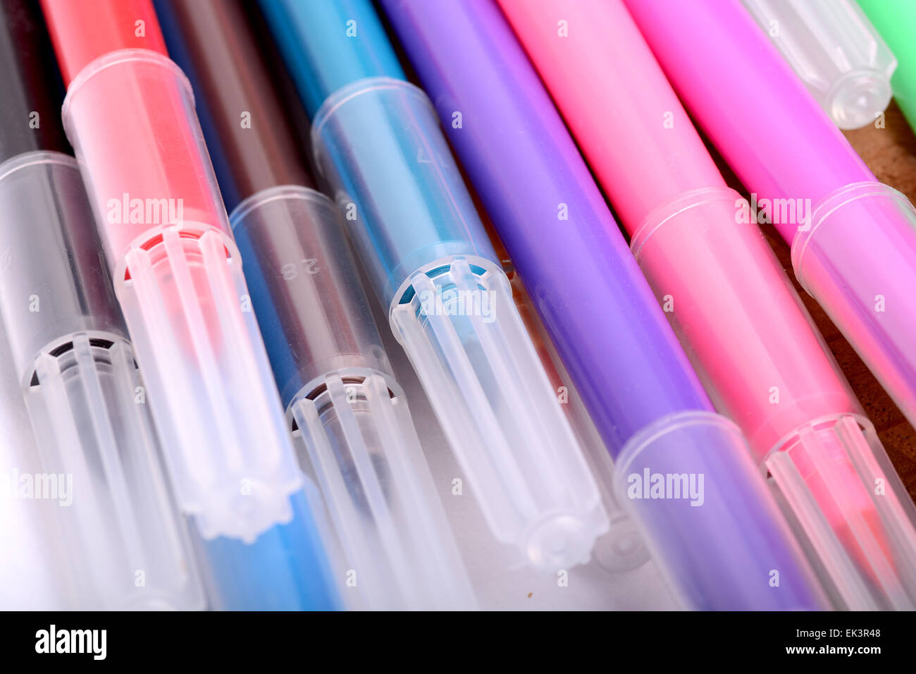 highlighter markers set on wooden plate Stock Photo Alamy