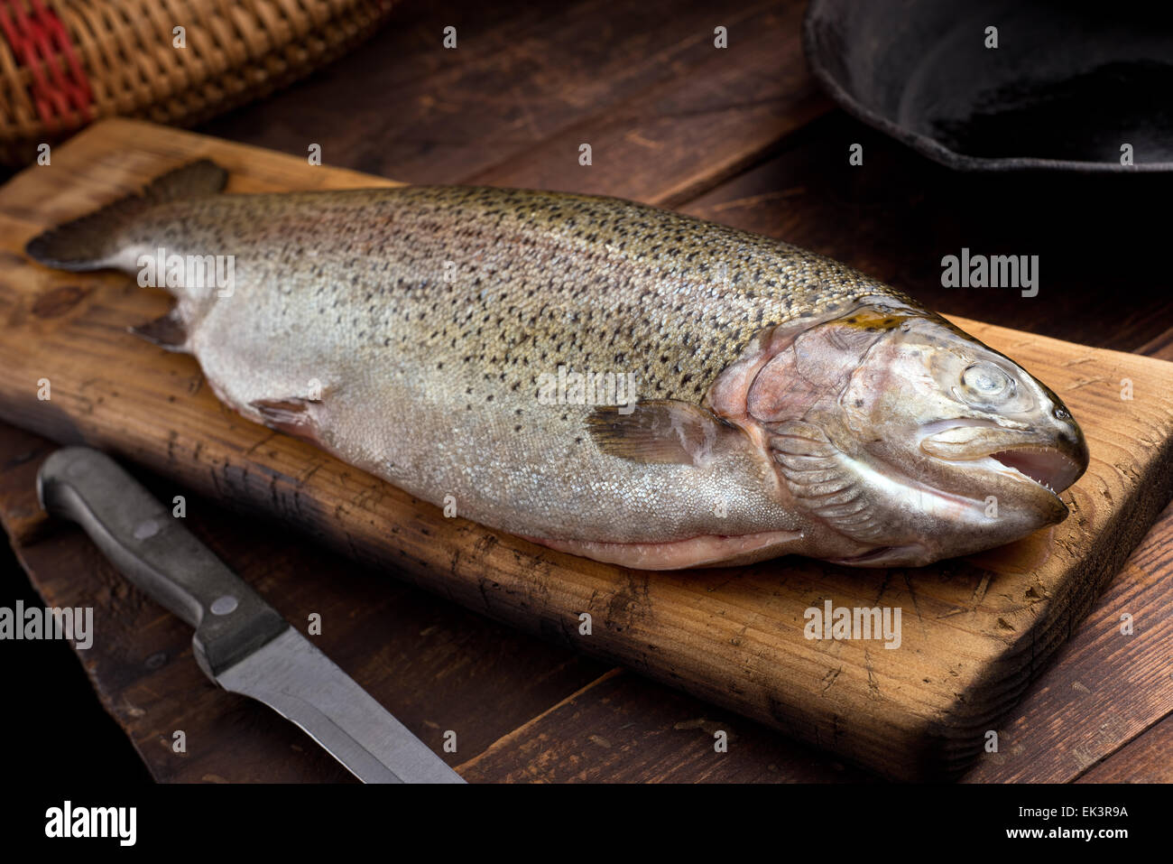 A Rainbow Trout On Cutting Board In A Rustic Cabin Stock Photo Alamy