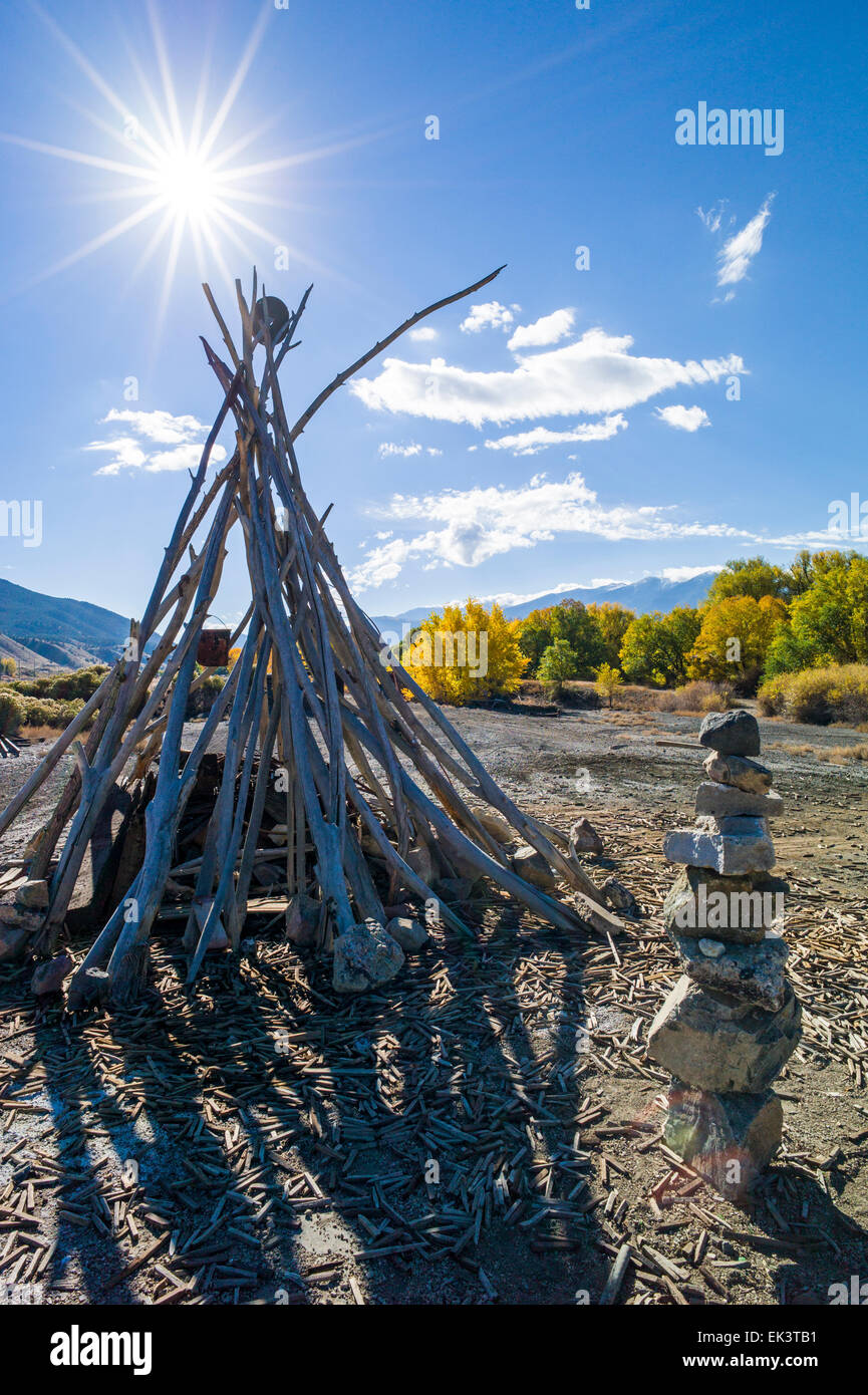 Barren land along Arkansas River owned by Union Pacific Railroad. An artist has creatively arranged some of the relics. Stock Photo