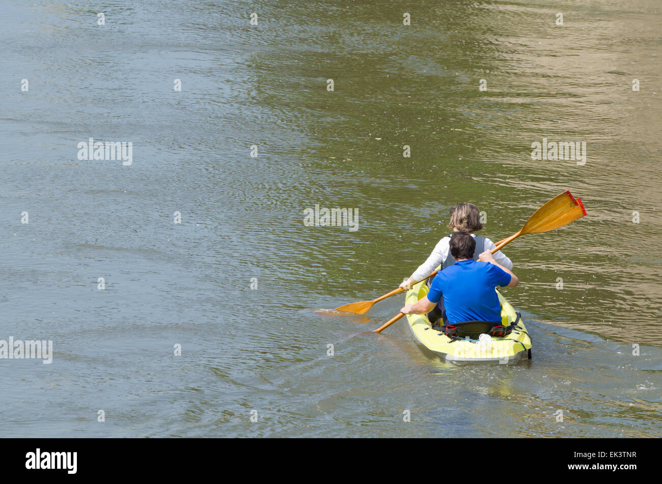 Older Woman and Man in Plastic Canoe on the River Stock Photo
