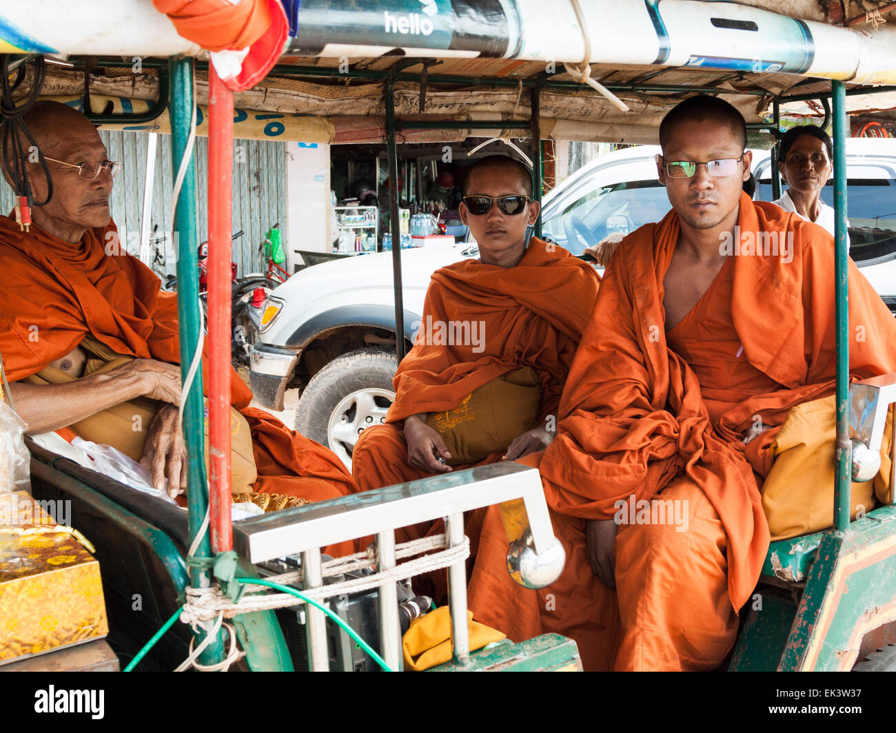 Buddhist monks waiting for alms near Kampot market in Cambodia, Asia. Stock Photo