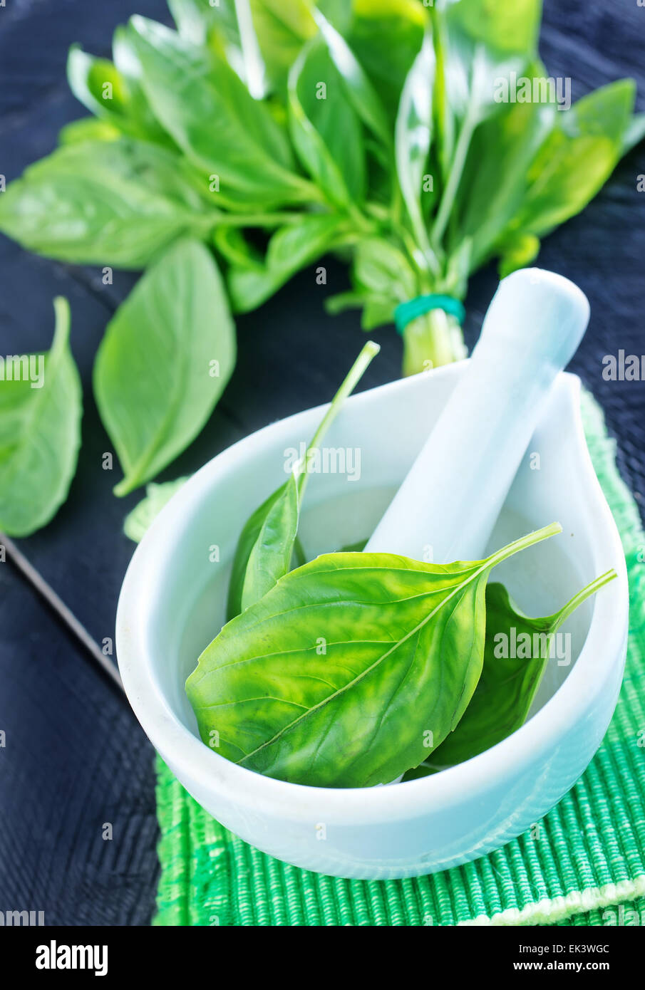 fresh basil in bowl and on a table Stock Photo - Alamy