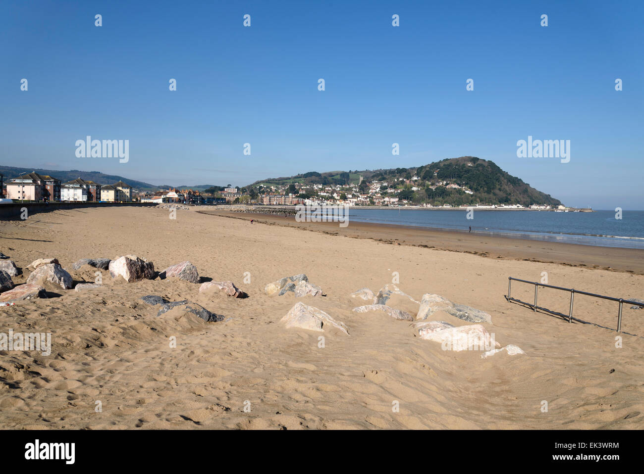 Early spring cloudless blue sky over Minehead beach at low tide, Somerset, UK. Stock Photo